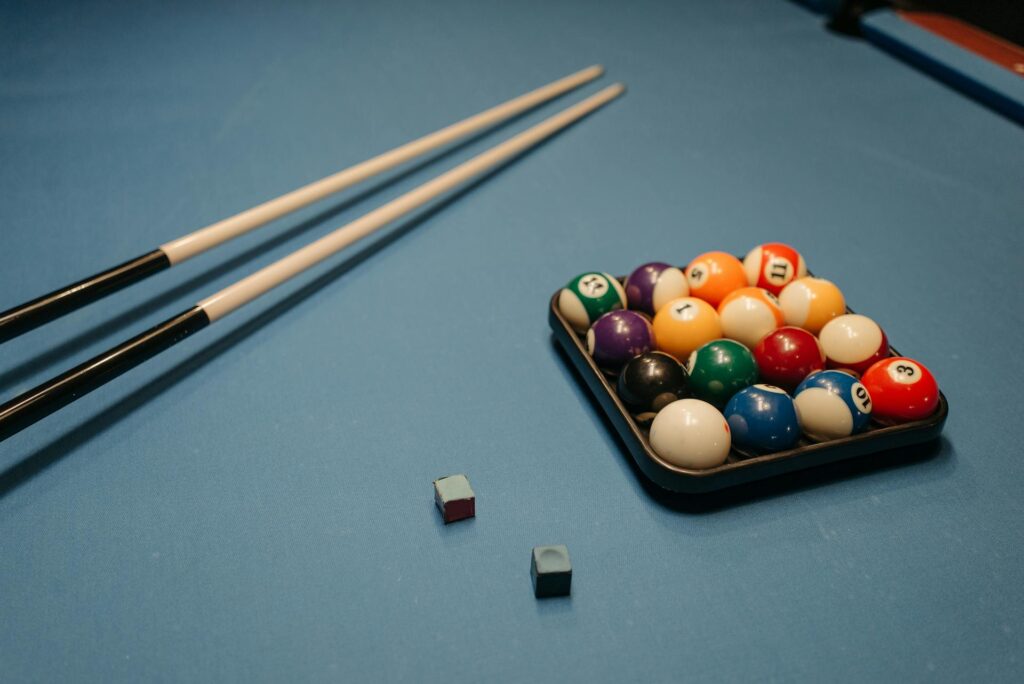 Pool sticks on a pool table